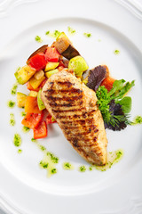 Macro Shot of Grilled Chicken Fillet with Side Dish of Baked Vegetables