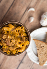 Homemade Cheeseburger Macaroni and cheese served in a small brown bowl made with ground turkey