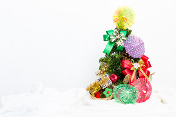 Christmast tree with colourful paper umbrella and decoration item