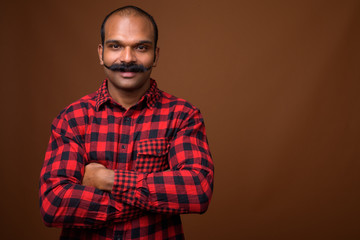 Portrait of Indian hipster man with mustache