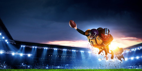 American football players fight for ball. Mixed media - obrazy, fototapety, plakaty