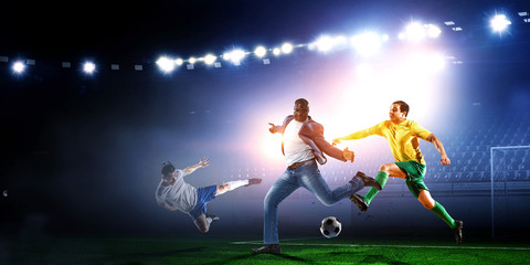 Soccer man in action with ball. Mixed media