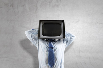 Monitor headed businessman. Mixed media