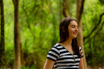 Fototapeta premium Young woman in parkland 