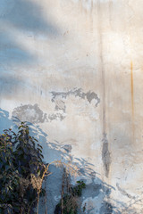 Old wall with peeling stucco. wall texture with natural light