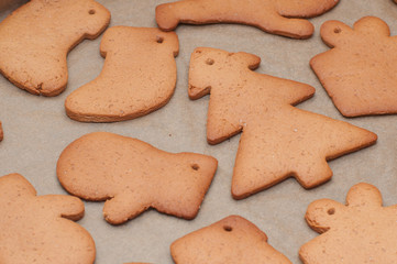 Fresh baked homemade Chritstmas gingerbread cookie on a baking tray.