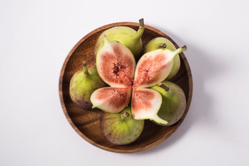 Fresh fig fruit half and quarter isolated