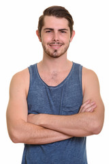 Fototapeta premium Portrait of happy young handsome bearded man ready for gym