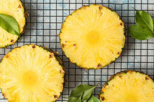  Whole and sliced tropical pineapple on cutting board with copy space. Top view