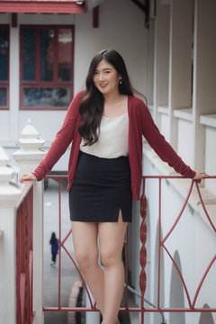 Portrait of thai adult working women white shirt relax and smile