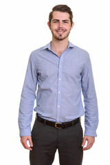 Fototapeta premium Portrait of happy young handsome bearded businessman