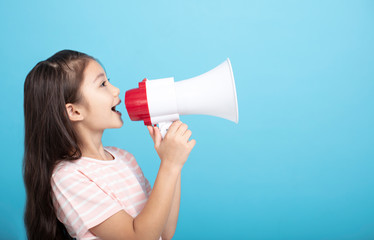 Little girl screaming and shouting with megaphone
