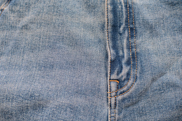 Detail of vintage blue denim jeans texture background , fashion vintage jeans .