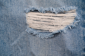 Detail of vintage blue denim jeans texture background , fashion vintage jeans .