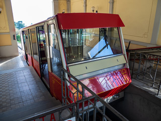 Bergamo, Italy. The red funicular at the upper station of San Vigilio. It is a cable car that...