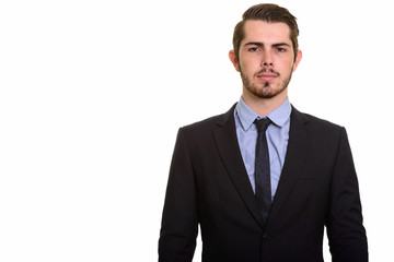 Portrait of young handsome bearded businessman in suit
