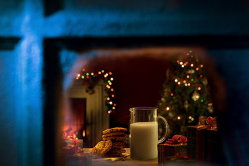 close up view of glass of milk with cookies on color back