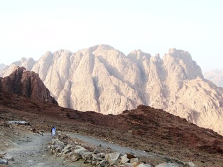 Tourists are hiking in the Mount Sinai, which is a mountain in the Sinai Peninsula of Egypt, for...