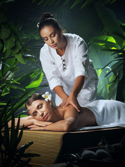 portrait of young beautiful woman in spa environment