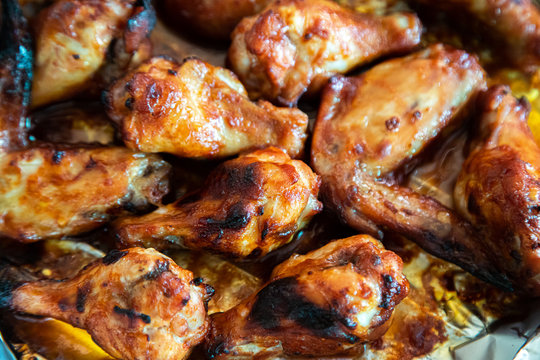 Close up image Grilled chicken wings and legs on  table, Top view.