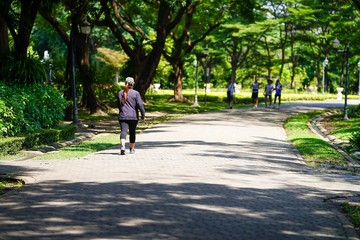 young woman riding bicycle in park