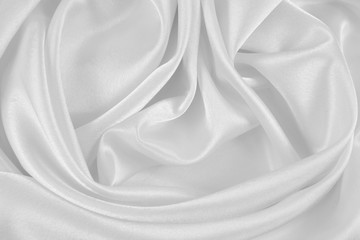 Naklejka na ściany i meble The texture of the satin fabric of white color for the background