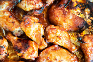 Close up image Grilled chicken wings and legs on  table, Top view.