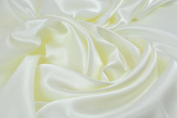 Obraz premium The texture of the satin fabric of white color for the background