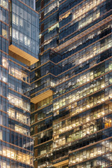 Obraz premium Scenic glowing windows of skyscrapers. Modern office buildings