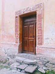 Fototapeta premium old door in brick wall
