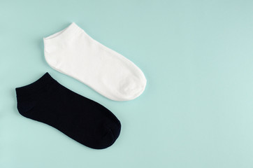 Kids socks composition on blue background. Flat lay.