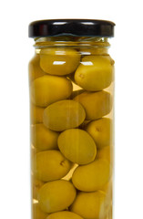 Glass jar with green olives. Canning supply food.