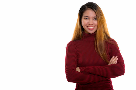 Studio shot of young Asian woman with turtleneck sweater