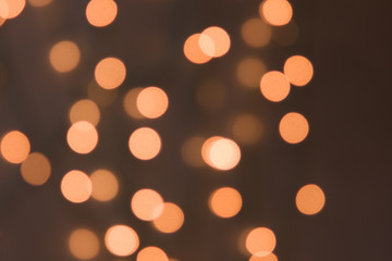Christmas background. Festive abstract background with bokeh defocused lights and stars