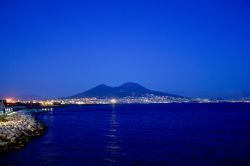 A night view of the Neapolitan Bay and Volcano Vesuvius, Naples, Italy.