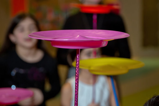 Fun with Spinning Plates .balancing a spinning plate. A collection of spinning purple plates .