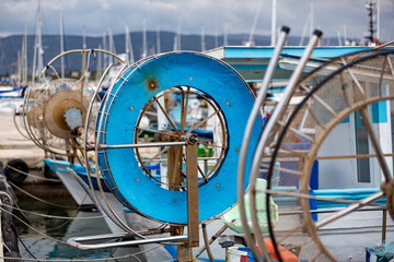 Fishing boats, gear and equipment in the harbour at Latsi, Cyprus