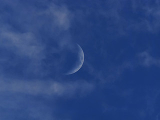 Obraz na płótnie Canvas moon on the blue sky. the clouds