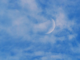 Obraz na płótnie Canvas moon on the blue sky. the clouds