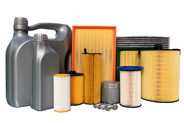 Oil filter, air filter, cabin filter, spark plugs, oil cans. Spare parts of a car on a white...