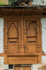 Obraz premium old wooden door in wall