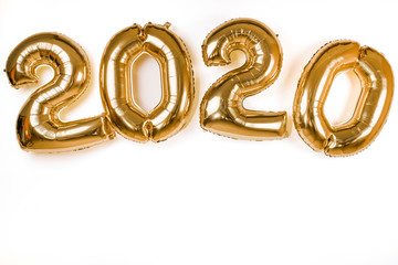 golden 2020 new year balloons isolated over white wall