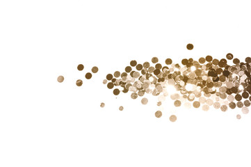Blurry background with gold glitter on white, shiny confetti in vintage colors
