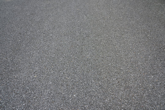 Low angle view of asphalt pavement texture