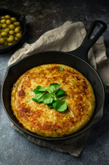 Spanish tortilla with extras on the table