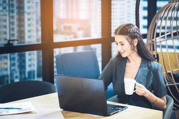 businesswomen working with laptop  morning with coffee cup