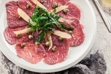 Beef carpaccio with arugula and parmesan