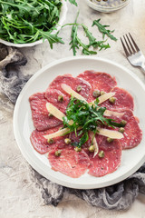Beef carpaccio with arugula and parmesan