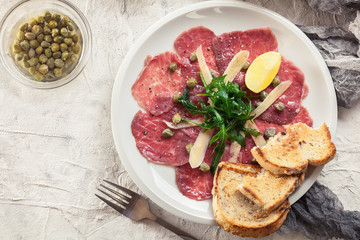 Beef carpaccio with arugula and parmesan