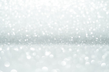 Silver Sparkling Lights Festive background with texture. Abstract Christmas twinkled bright bokeh defocused and Falling stars. Winter Card or invitation	